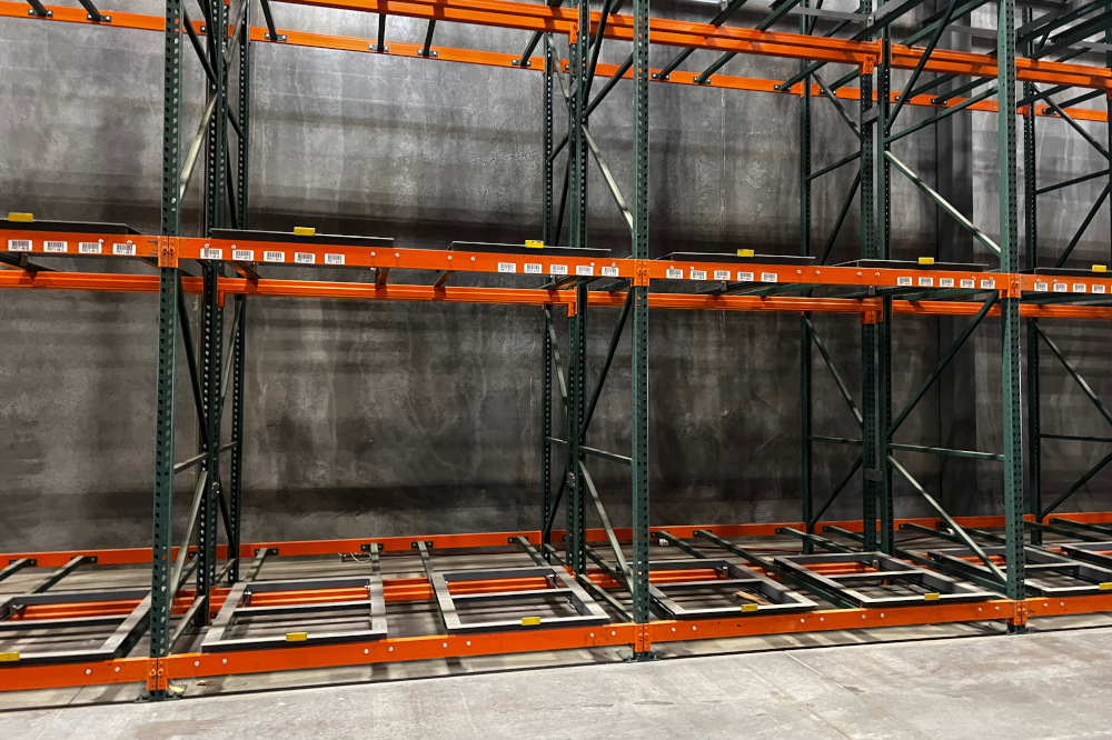 Front view of a pushback rack system with loaded pallets